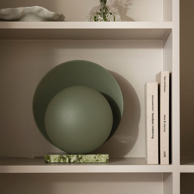 Okrągła designerska lampa stołowa zielona na komodę